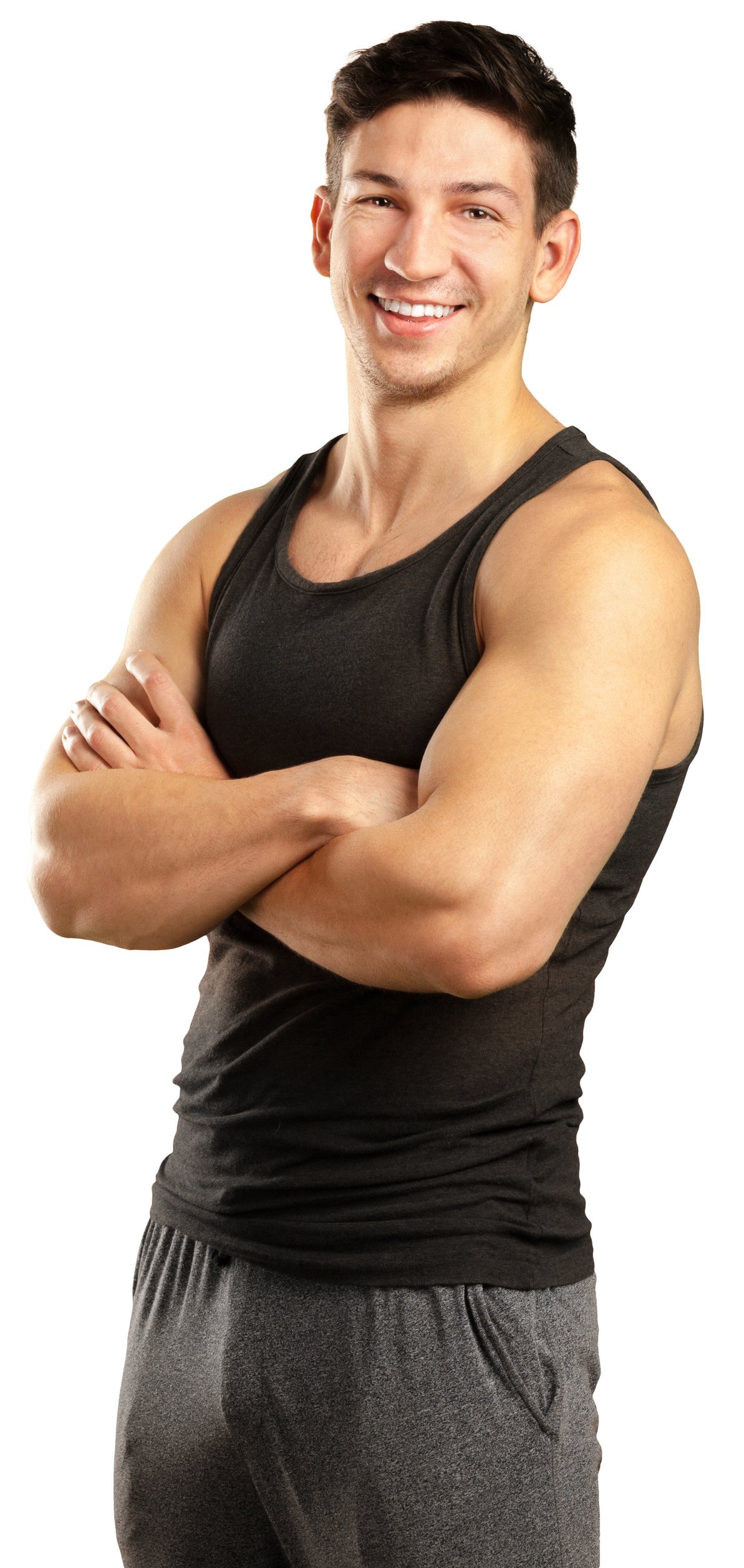 Home fitness enthusiast poses with confidence in casual workout clothing and a friendly smile indoors